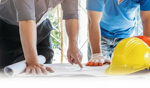 A professional construction team reviewing building plans and ensuring quality service